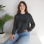 She is STRONG - Unisex Heavy Blend™ Crewneck Sweatshirt - Front Black Logo - Plain Back