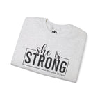 She is STRONG - Unisex Heavy Blend™ Crewneck Sweatshirt - Front Black Logo - Plain Back