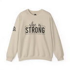 She is STRONG - Unisex Heavy Blend™ Crewneck Sweatshirt - Front Black Logo - Plain Back