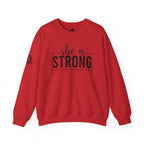 She is STRONG - Unisex Heavy Blend™ Crewneck Sweatshirt - Front Black Logo - Plain Back