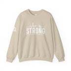 She is STRONG - Unisex Heavy Blend™ Crewneck Sweatshirt - Front White Logo - Plain Back