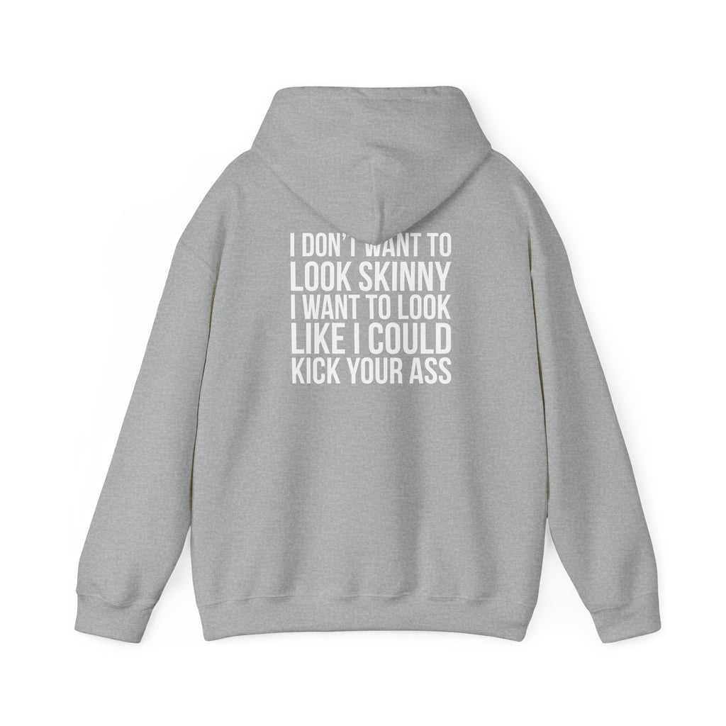 I DON’T WANT TO LOOK SKINNY, I WANT TO LOOK LIKE I CAN KICK YOUR ASS – Unisex Heavy Blend™ Hooded Sweatshirt (White Logo) 🤍