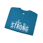 She is STRONG - Unisex Heavy Blend™ Crewneck Sweatshirt - Front White Logo - Plain Back