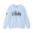 She is STRONG - Unisex Heavy Blend™ Crewneck Sweatshirt - Front Black Logo - Plain Back