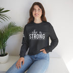 She is STRONG - Unisex Heavy Blend™ Crewneck Sweatshirt - Front White Logo - Plain Back