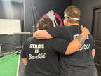 Strong Is Beautiful  - Unisex Softstyle T-Shirt - White Print on on back.