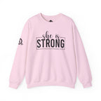 She is STRONG - Unisex Heavy Blend™ Crewneck Sweatshirt - Front Black Logo - Plain Back