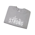 She is STRONG - Unisex Heavy Blend™ Crewneck Sweatshirt - Front White Logo - Plain Back