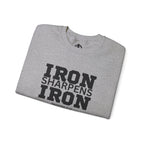 Iron Sharpens Iron - Unisex Heavy Blend™ Crewneck Sweatshirt - Front Black Logo - Plain Back