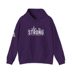 She is STRONG - Unisex Heavy Blend Hooded Sweatshirt - White Logo
