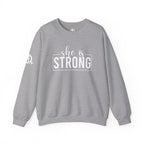 She is STRONG - Unisex Heavy Blend™ Crewneck Sweatshirt - Front White Logo - Plain Back