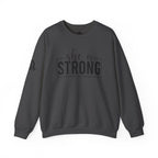 She is STRONG - Unisex Heavy Blend™ Crewneck Sweatshirt - Front Black Logo - Plain Back