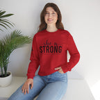 She is STRONG - Unisex Heavy Blend™ Crewneck Sweatshirt - Front Black Logo - Plain Back