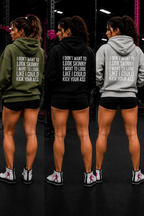 I DON’T WANT TO LOOK SKINNY, I WANT TO LOOK LIKE I CAN KICK YOUR ASS – Unisex Heavy Blend™ Hooded Sweatshirt (White Logo) 🤍