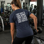 Kick Your Ass – Unisex Softstyle Tee | White Front, Plain Back