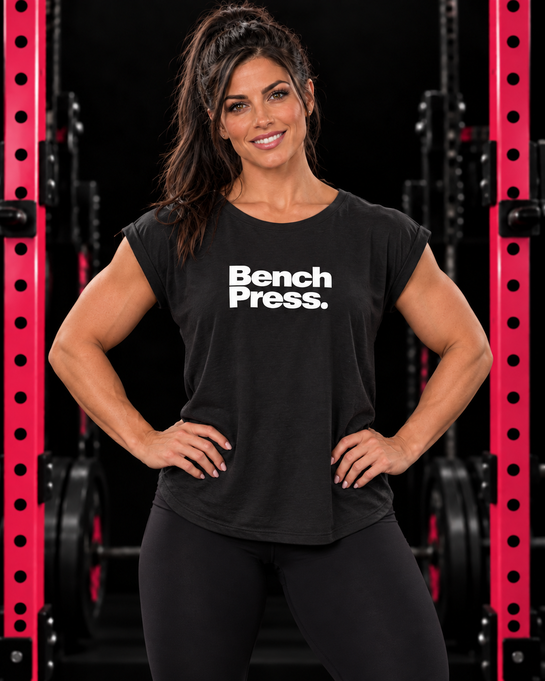 Bench. Press. Women’s Muscle Tee — Flowy Rolled Cuff Gym Top — collection design in black gym with pink racks