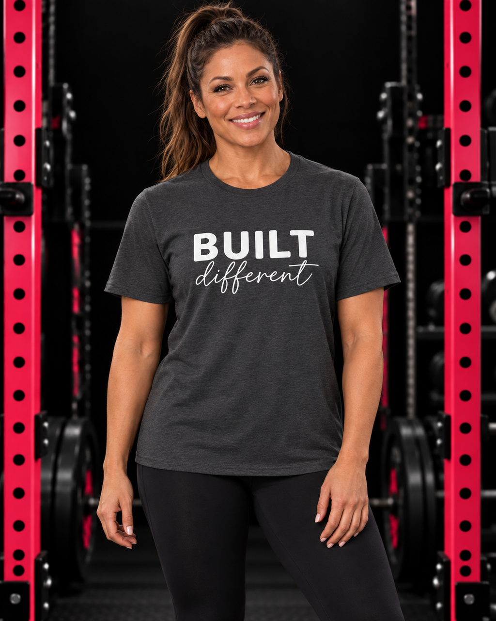 Built Different Unisex Softstyle T-Shirt — Front White Logo — Built Different collection hero in black and pink gym