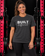 Built Different Unisex Softstyle T-Shirt — Front White Logo — Built Different collection hero in black and pink gym