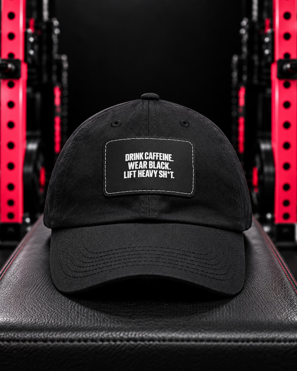Black slogan leather patch dad cap on a gym bench