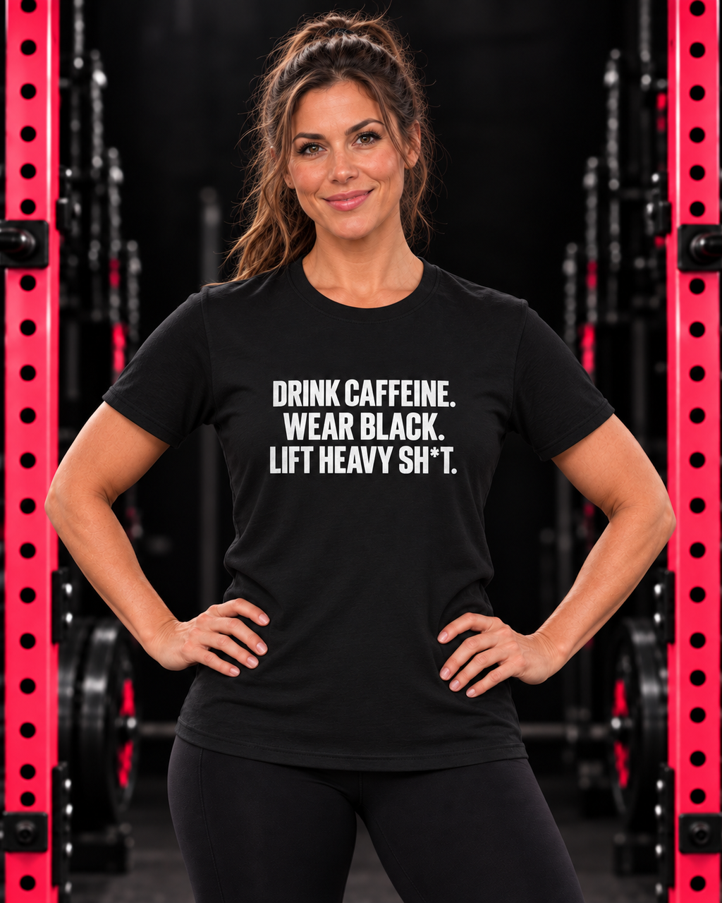 Front-facing woman wearing black women’s Softstyle tee with white Drink Caffeine collection print