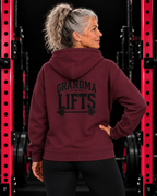 Grandma Lifts black back logo maroon hoodie on mature woman