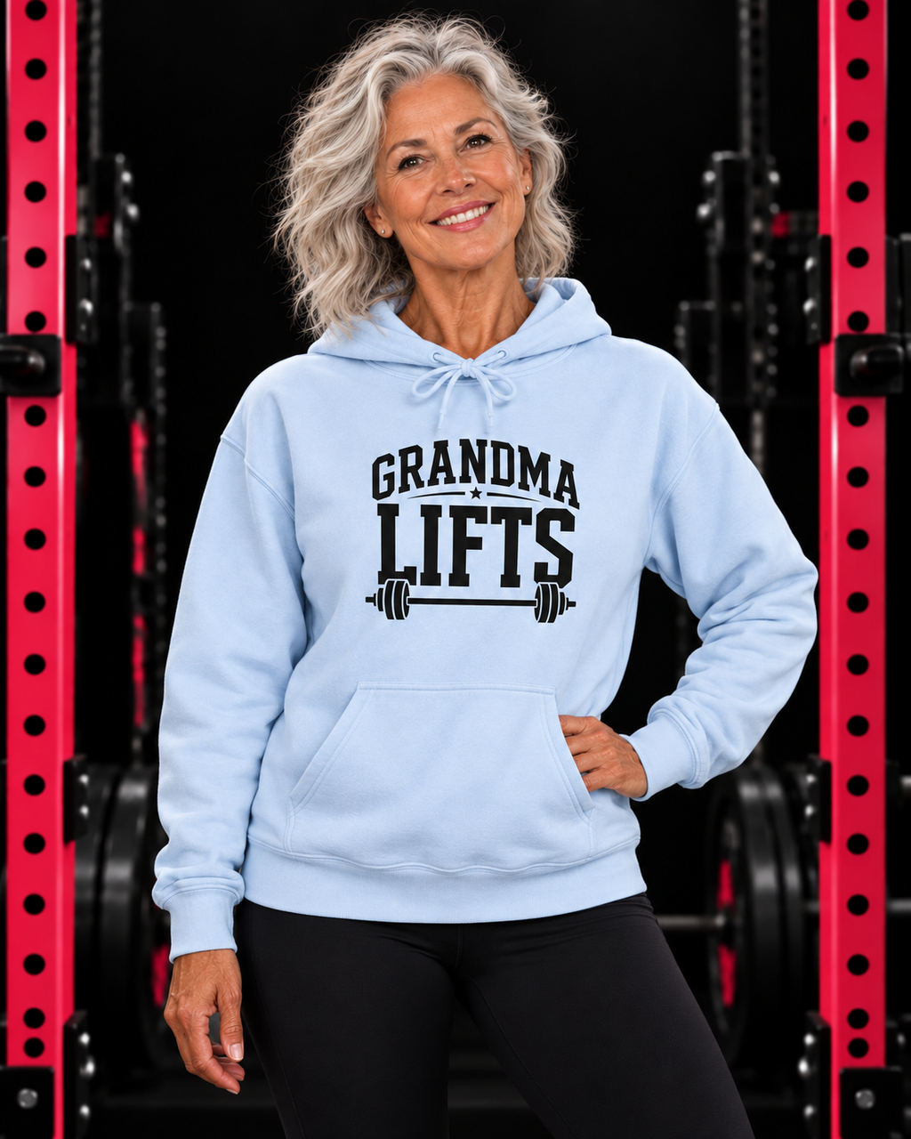 Grandma Lifts black front logo light blue hoodie on mature woman in gym