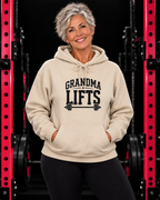 Grandma Lifts black front logo sand hoodie on mature woman in gym