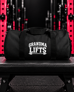 Grandma Lifts duffel in signature pink rack gym