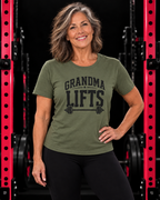 Grandma Lifts black front logo military green tee on a mature woman in the gym