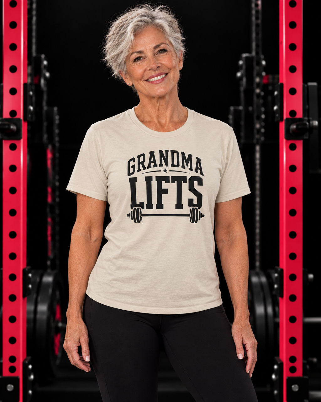 Grandma Lifts black front logo natural tee on a mature woman in the gym