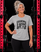 Grandma Lifts black front logo sport grey tee on a mature woman in the gym