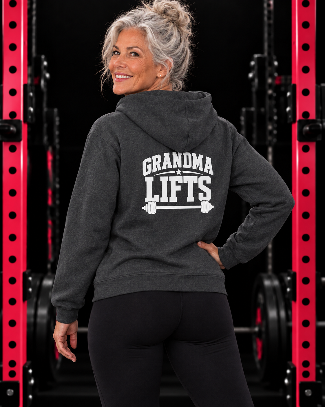 Grandma Lifts dark heather hoodie on a mature woman in the gym