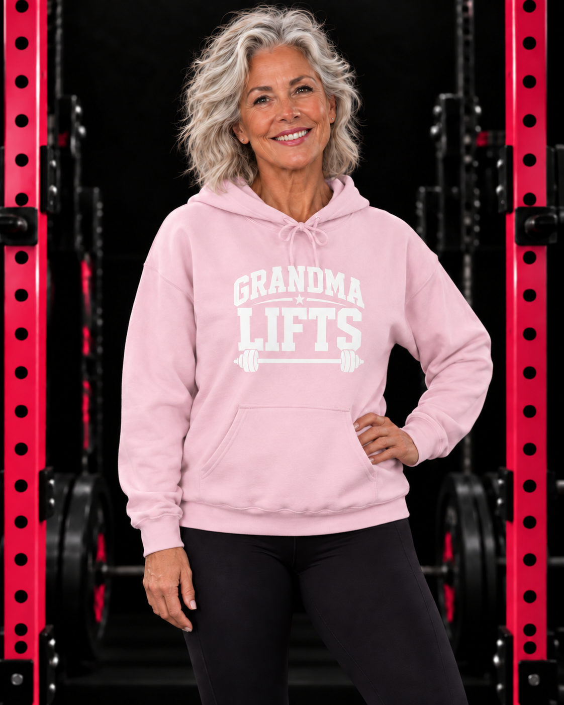 Grandma Lifts light pink hoodie on a mature woman in the gym