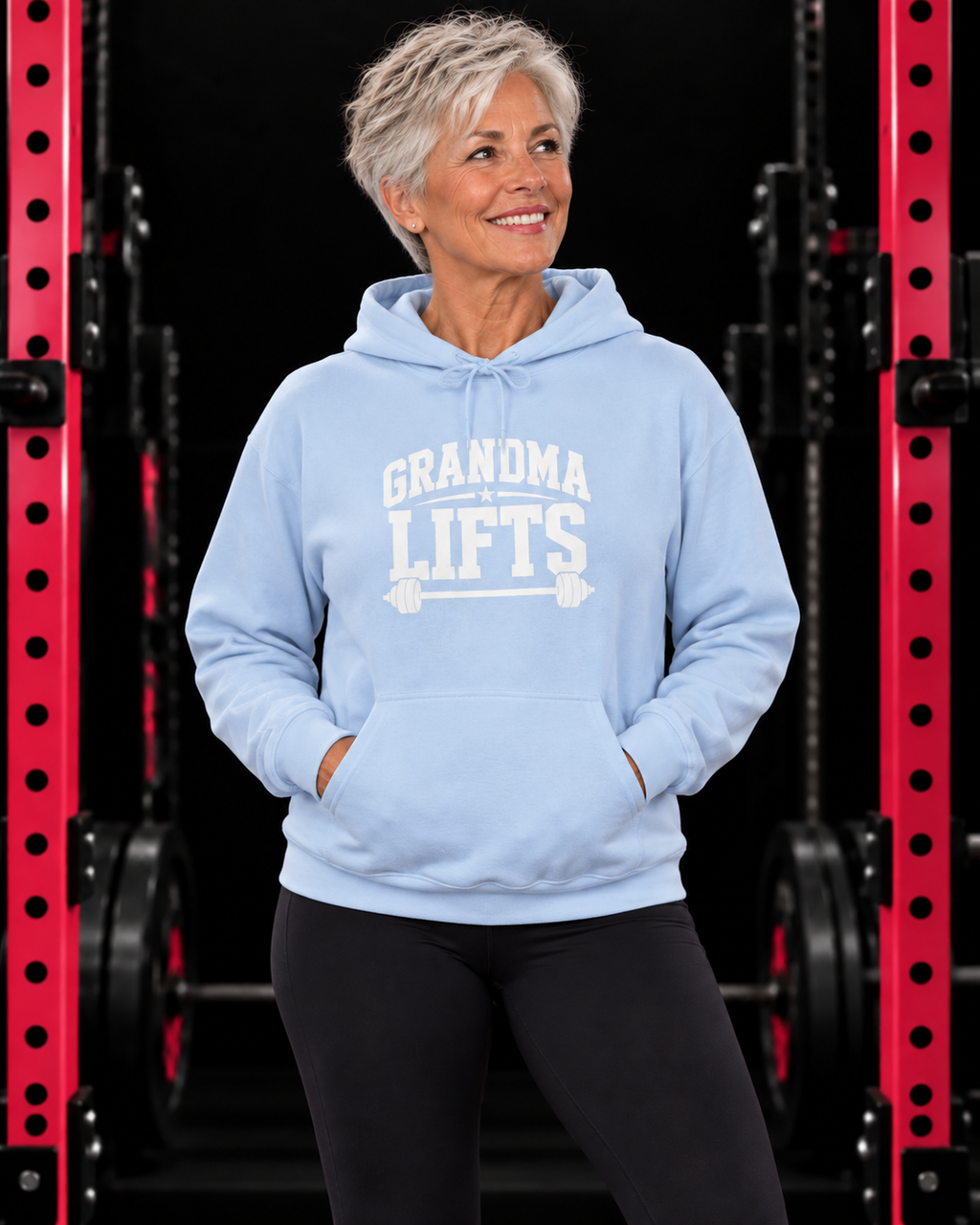 Grandma Lifts white front logo hoodie in light blue on a mature woman in the WWLW gym
