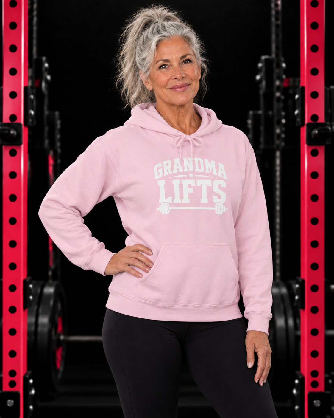 Grandma Lifts white front logo hoodie in light pink on a mature woman in the WWLW gym