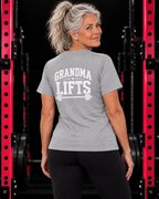 Grandma Lifts sport grey unisex tee on a mature woman in the gym