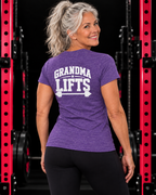 Grandma Lifts heather purple women's tee on a mature woman in the gym