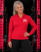 Grandma Lifts quarter-zip pullover in True Red, worn by a fit grandmother