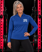 Grandma Lifts quarter-zip pullover in True Royal, worn by a fit grandmother
