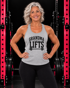 Grandma Lifts grey racerback tank with black logo on mature woman in black gym with pink racks