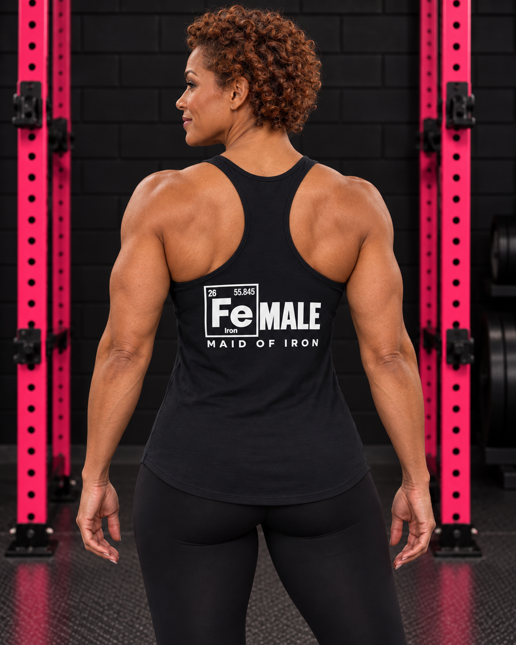 Athletic woman showing the Maid of Iron back print on a black Next Level racerback tank