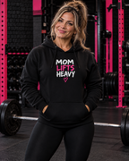 Mom Lifts Heavy black pullover hoodie in the WWLW gym