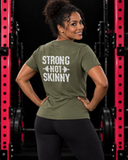 Strong Not Skinny white distressed back logo military green tee on strong woman