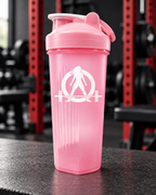 WWLW Protein Shaker Bottle — 24oz - Pink & White — portrait product photo on a charcoal counter in the WWLW gym