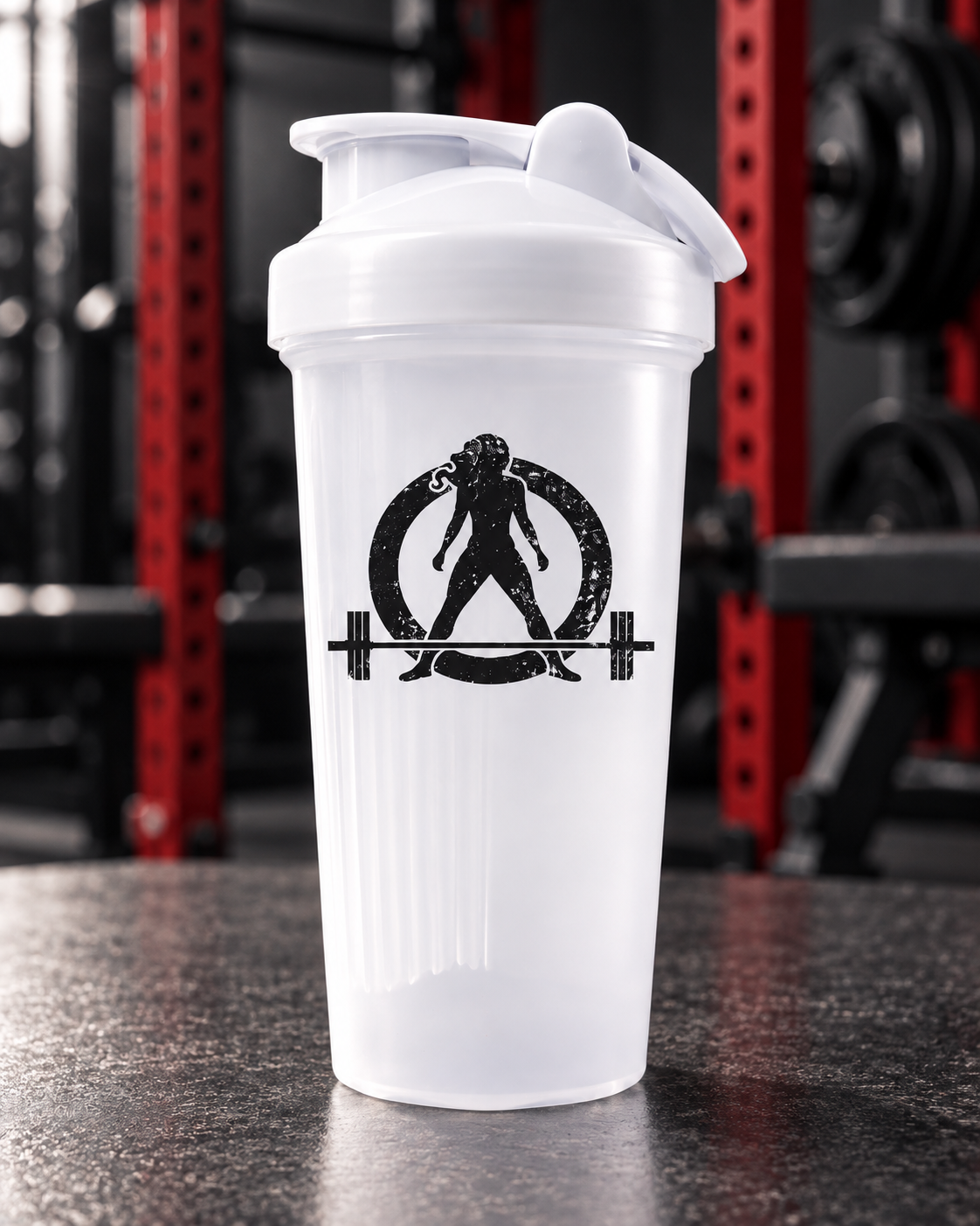WWLW Protein Shaker Bottle — 24oz — portrait product photo on a charcoal counter in the WWLW gym