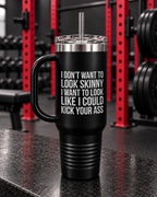 I Don't Want To Look Skinny I Want To Look Like I Can Kick Your Ass - 40oz Insulated Travel Mug — portrait product photo on a charcoal counter in the WWLW gym