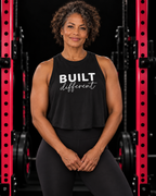 Built Different - Women's Crop Top - White Logo, solid-black-blend, front view, black gym and pink rack