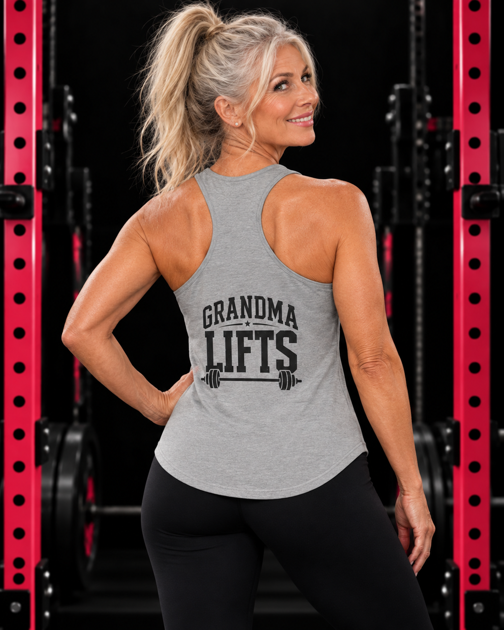 Grandma Lifts - Women's Ideal Racerback Tank - White Logo Front & Back, heather-grey, back view in black gym with pink rack