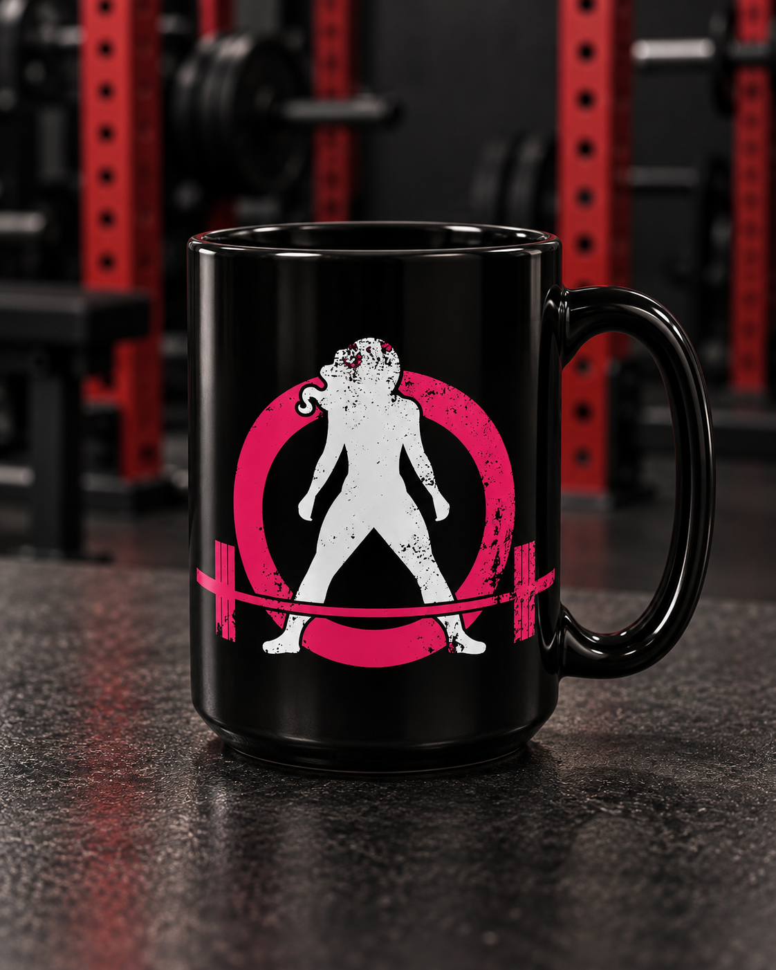 Black Mug, 15oz - Distressed Black Logo — portrait product photo on a charcoal counter in the WWLW gym