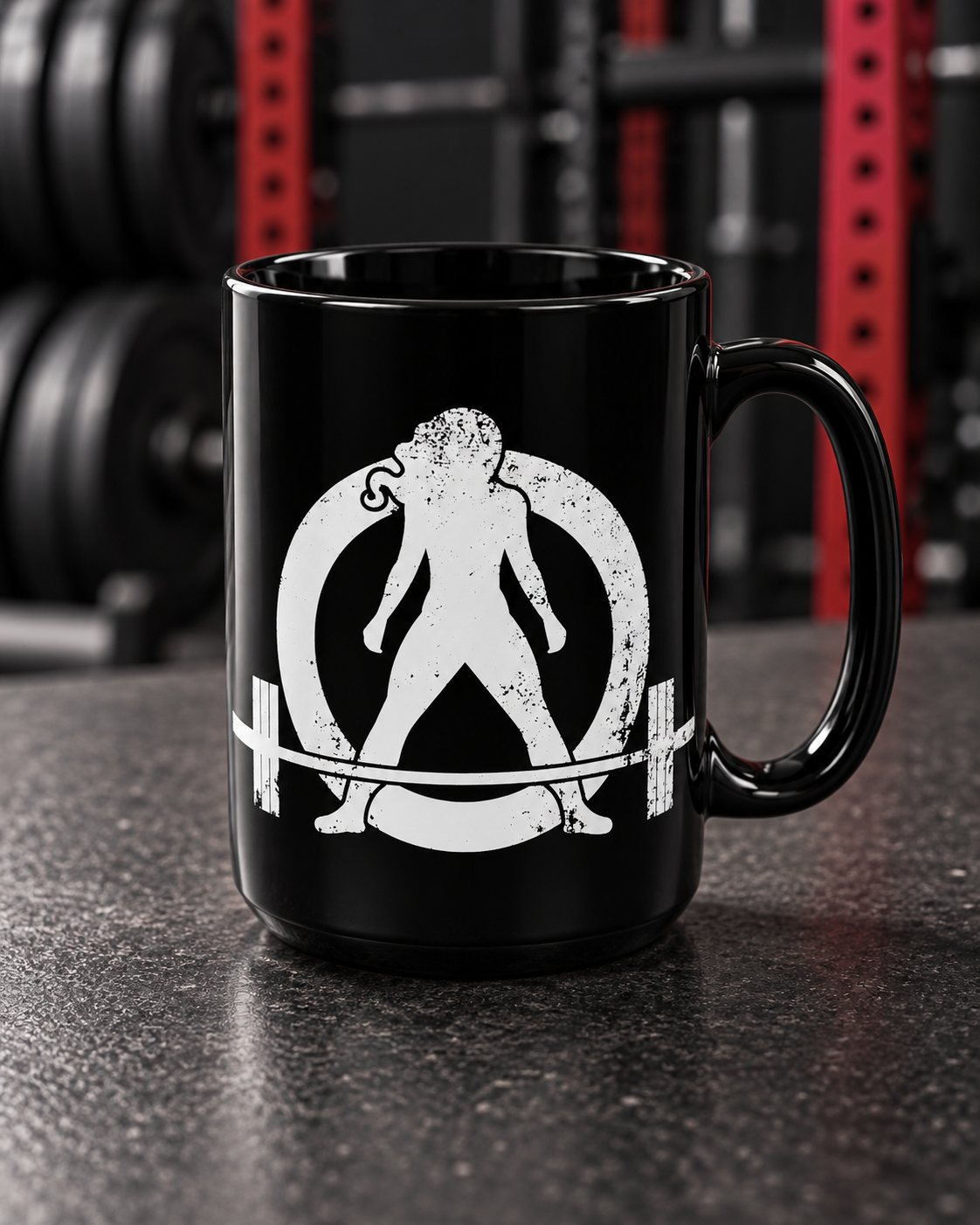 Distressed - Black Mug, 15oz - White Logo — portrait product photo on a charcoal counter in the WWLW gym
